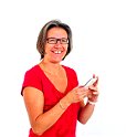 Woman in red t shirt on smartphone in studio
