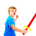 Young boy in studio playing with sword on white background